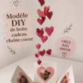 Boîte cadeau en forme de cœur, modèle DIY avec décorations colorées.